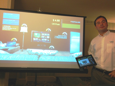 Gago Masagué uses a tablet device to control the simulated electronics and appliances on the Wall of Power demo